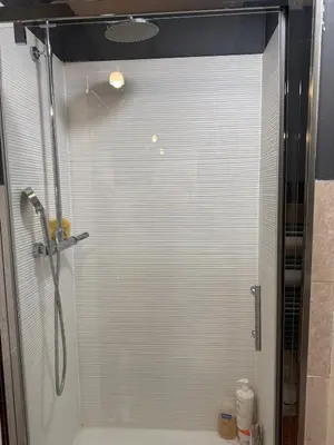a bathroom with a shower with a glass window at Studio cosy Cannes centre in Cannes