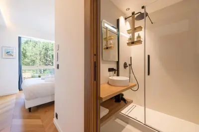 a bathroom with a sink and a mirror at 2-Br Apartment with Sea View Terrace Cannes in Cannes
