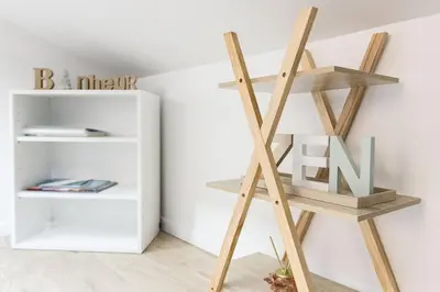 a wooden ladder in a room with a shelf at Bulle d'Azur - 10mn from Palais&Beaches, air conditioning, center in Cannes