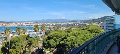 a balcony with a view of a city and the water at Vue unique sur toute la baie de Cannes et la mer in Cannes