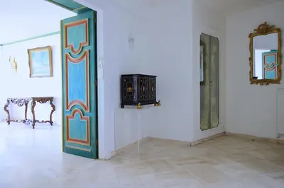 a room with a door and paintings on the wall at Vue unique sur toute la baie de Cannes et la mer in Cannes