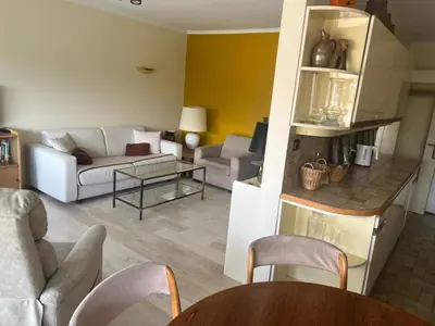a living room with a couch and a table at Le Cannet Rocheville grand 3 pieces 2 terrasses in Le Cannet