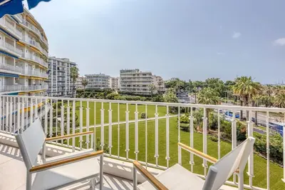 a balcony with chairs and a view of the ocean at Dune Croisette - Sea view in Cannes