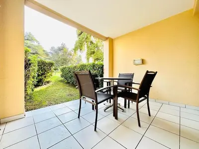 a dining room with a table and chairs on a patio at Vue Mer, Piscine de ouf Votre Oasis à Cannes in Cannes