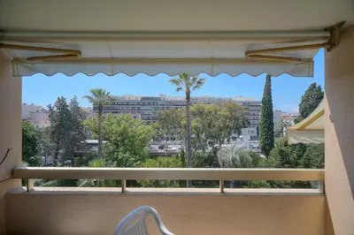 a window with a view of a city at REF 1514 - Apartment with unobstructed view to rent in Cannes
