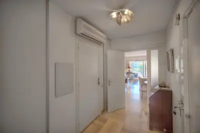 a hallway with a white door and a ceiling at REF 1514 - Apartment with unobstructed view to rent in Cannes