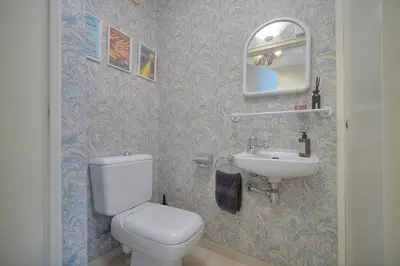 a bathroom with a toilet and a sink at REF 1514 - Apartment with unobstructed view to rent in Cannes