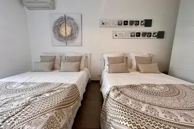 two beds sitting next to each other in a room at REF 1921 - Cannes - Apartment for rent in Cannes
