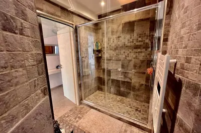 a shower with a glass door in a bathroom at REF 1921 - Cannes - Apartment for rent in Cannes