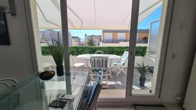 a view of a balcony with a table and chairs at Appartement 2P Terrasse Cannes Croisette Beach 100 meters in Cannes