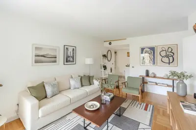 a living room with a white couch and a table at Central T2 Cannes Suquet - terrasse - WIFI - Clim in Cannes