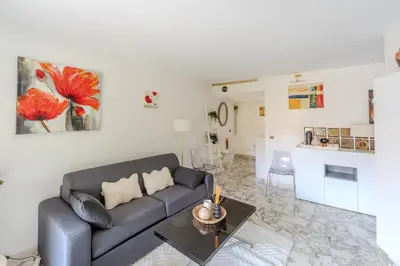 a fence in front of a building with a tree at Central T2 Cannes Suquet - terrasse - WIFI - Clim in Cannes