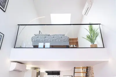 a room with a large mirror on the wall at Le Corail - SCLS Locations in Cannes
