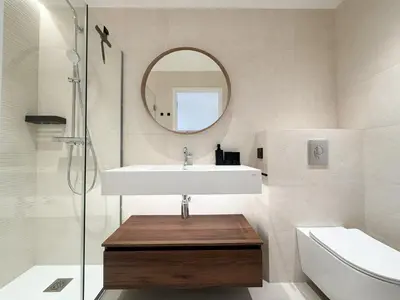 a bathroom with a sink and a mirror at Appartement De Luxe 5 Mins à Pied Du Palais Des Festivals by Halldis in Cannes