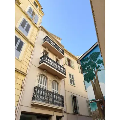 a building with balconies on the side of it at Appartement De Luxe 5 Mins à Pied Du Palais Des Festivals by Halldis in Cannes