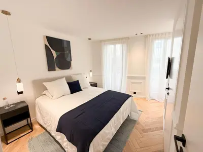 a bedroom with a large bed in a room at Appartement De Luxe 5 Mins à Pied Du Palais Des Festivals by Halldis in Cannes