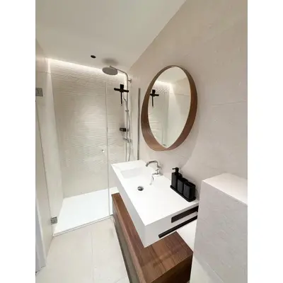 a white bathroom with a sink and a mirror at Appartement De Luxe 5 Mins à Pied Du Palais Des Festivals by Halldis in Cannes