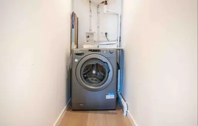 a washing machine in a corner of a room at Beautiful 2-room apartment on the Croisette in Cannes in Cannes