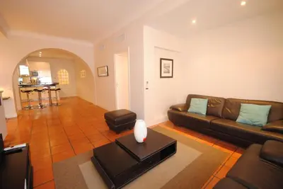 a living room with a couch and a table at Grand Palais 4P BOB1309 in Cannes