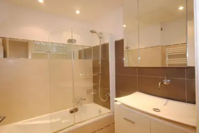a bathroom with a shower and a tub and a sink at Grand Palais 4P BOB1309 in Cannes
