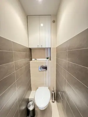 a small bathroom with a toilet and a sink at Grand Palais 4P BOB1309 in Cannes