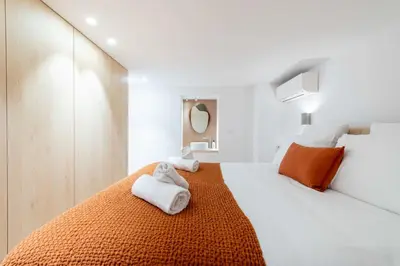 a bedroom with a bed with towels on it at 3-Br Attic Duplex Heart of Cannes in Cannes