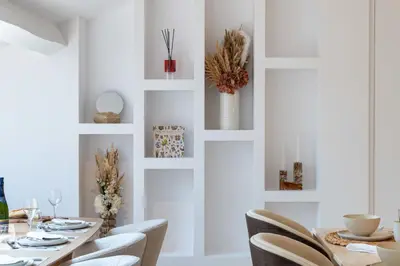 a dining room with a table and chairs at 3-Br Attic Duplex Heart of Cannes in Cannes
