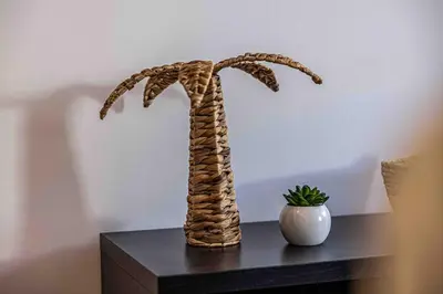 a statue of a palm tree on a table at 2 Pcs Plein Coeur Ville, Palace Festivals, Port Plages in Cannes