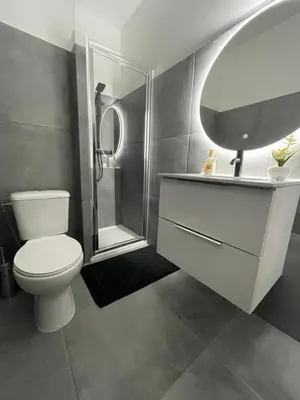 a bathroom with a toilet and a sink and a shower at studio luxueux in Le Cannet
