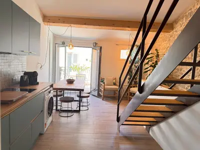a kitchen and dining room with a staircase in a house at CB Cannes - JUNGLE in Cannes