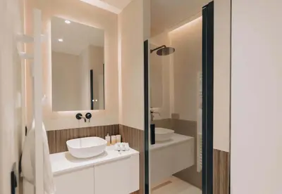 a bathroom with two sinks and a mirror at T2 Neuf et chic à deux pas de la Croisette in Cannes