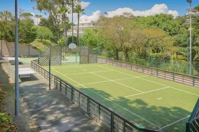 a tennis court with a net on top of it at Villa Francia 2P with splendid pool -private rental in Cannes