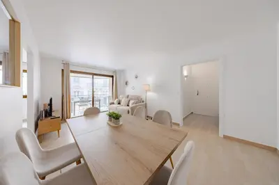a living room with a wooden table and chairs at Cannes 2 bedrooms apartment - 141A in Cannes