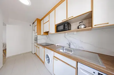 a kitchen with a sink and a washing machine at Cannes 2 bedrooms apartment - 141A in Cannes