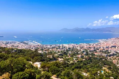 an aerial view of a city and the ocean at Villa exclusive au sommet de Cannes, 8 chambres, double piscine, vue sur la mer in Cannes