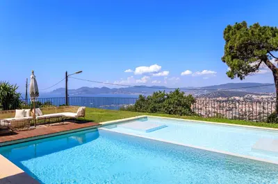 a swimming pool with a view of the city at Villa exclusive au sommet de Cannes, 8 chambres, double piscine, vue sur la mer in Cannes
