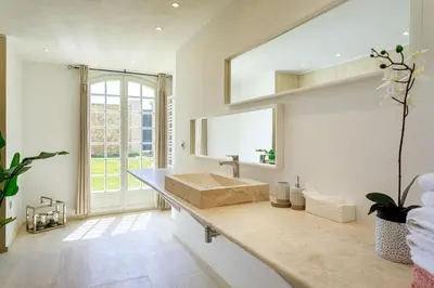 a bathroom with a sink and a large window at Villa exclusive au sommet de Cannes, 8 chambres, double piscine, vue sur la mer in Cannes