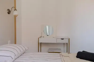 a bedroom with a bed and a tv on a table at Renovated 1 bedroom - AC - City Center in Cannes