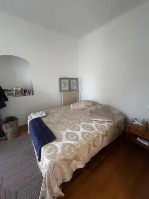 a bedroom with a large bed in a room at La Sérénade in Vallauris
