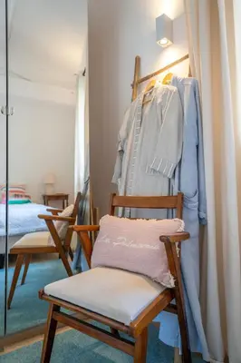 a room with two rocking chairs and a mirror at Magnifique villa avec piscine in Le Cannet