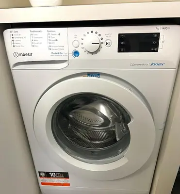 a white washing machine in a room at Panter Properties-24 in Cannes