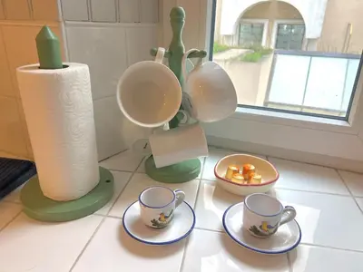 a group of cups and saucers on a counter at Panter Properties-24 in Cannes