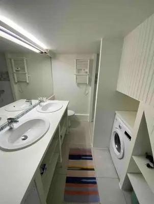 a bathroom with two sinks and a washing machine at Panter Properties-24 in Cannes