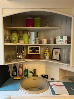 a kitchen counter with a sink and some dishes at Panter Properties-24 in Cannes