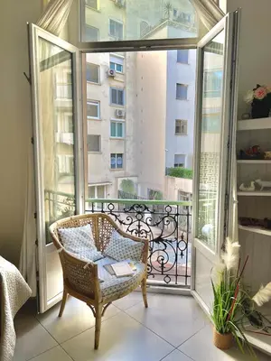 a room with a chair on a balcony at Panter Properties-24 in Cannes