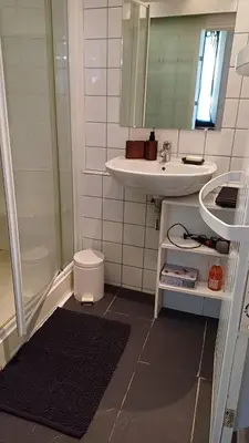 a bathroom with a sink and a shower and a toilet at Panter Properies Studio in Cannes