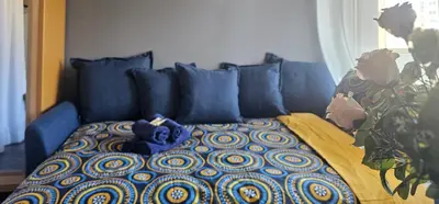 a blue bed with a blue teddy bear on it at Cannes South of France Apartment near beach, Palais des Festivals and Croisette in Cannes
