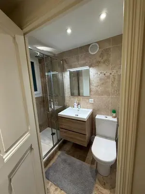 a bathroom with a toilet and a shower and a sink at COZY apartment 5 min Croisette Palais Festivals in Cannes