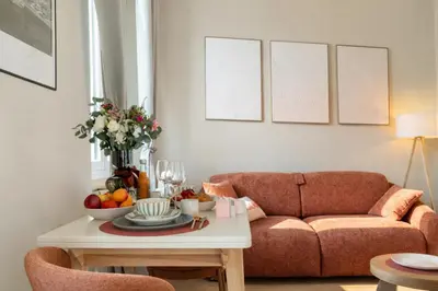 a bedroom with a large white bed with a lamp at Suite Tosca - Palais & Croisette 2min - Appartement Hôtel in Cannes