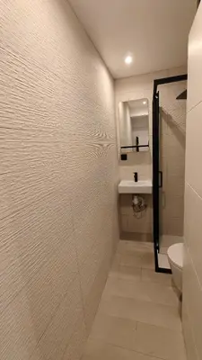 a bathroom with a shower and a toilet and a sink at Studio moderne in Cannes